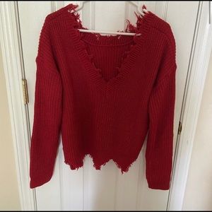 Red distressed sweater